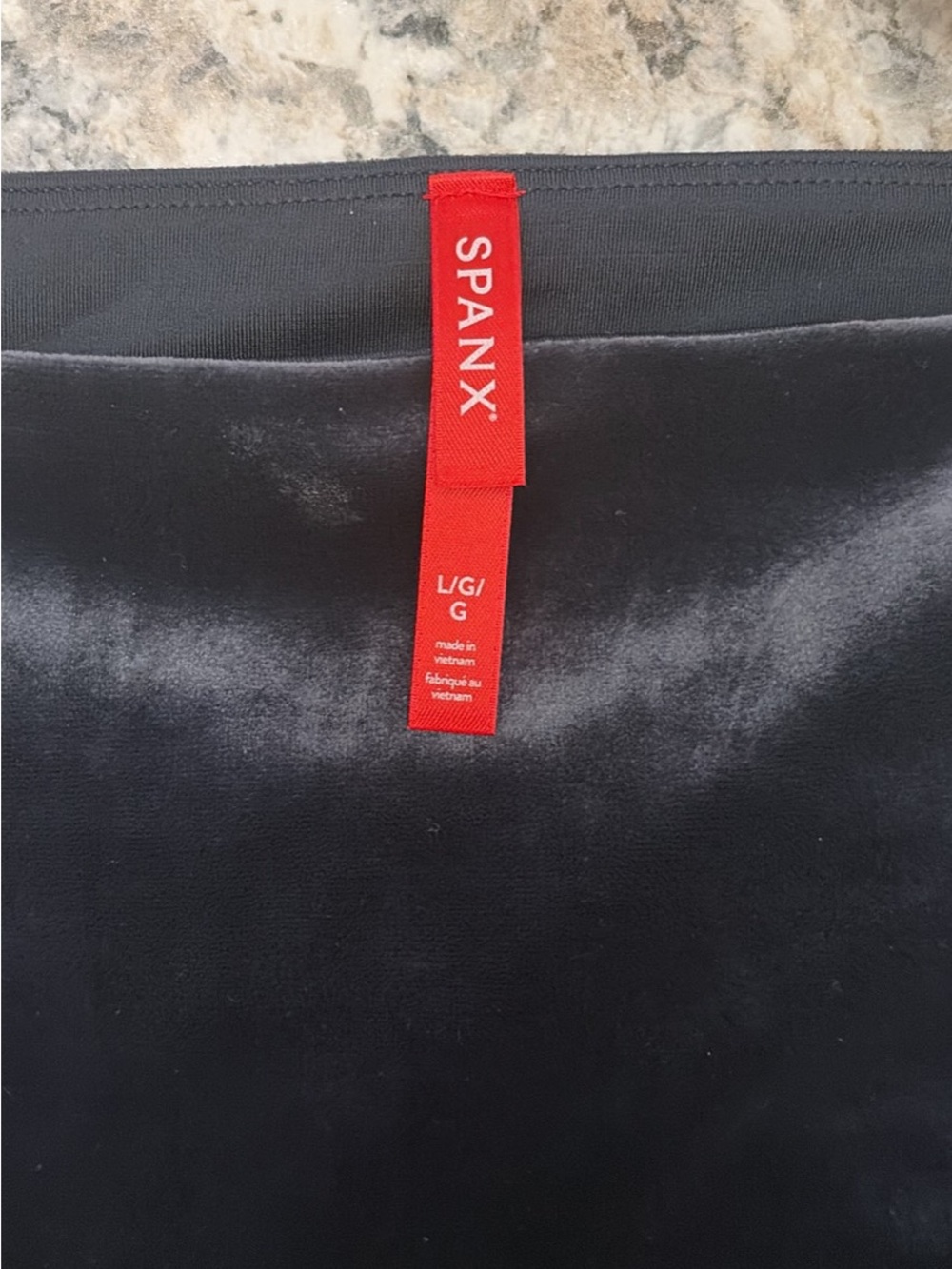 SPANX dark blue velour leggings.